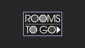 Rooms To Go logo. Text is white with varied shades of gray in the negative space of the letters.
