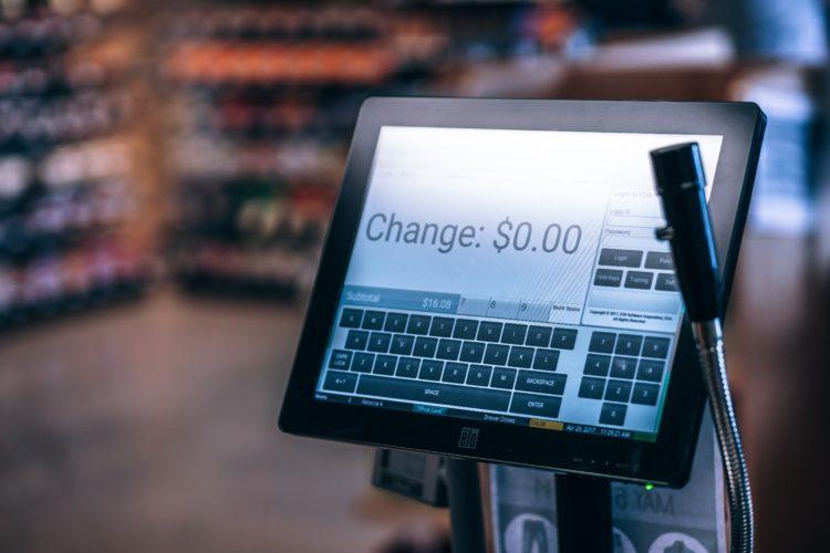 Photo of a point-of-sale system. The screen reads, "Change: $0.00".