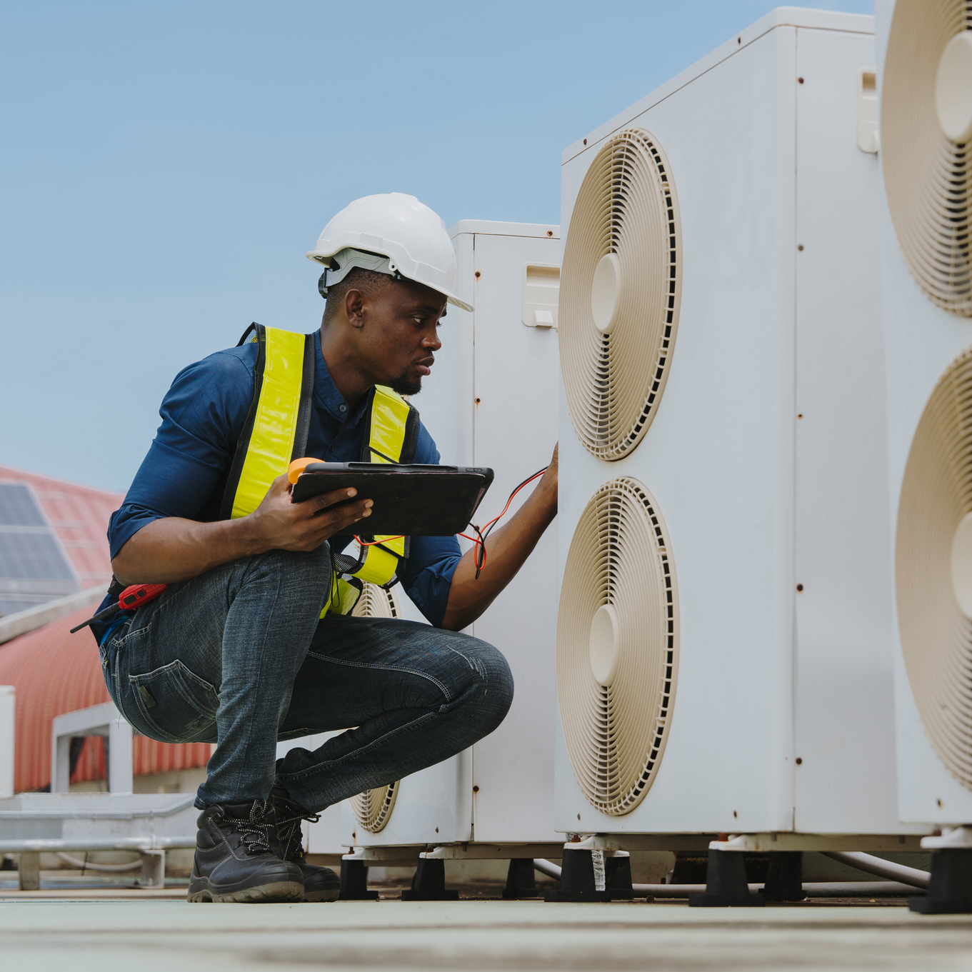 An Engineer Checking The Hot Coil System Of The Rooftop Air Conditioner