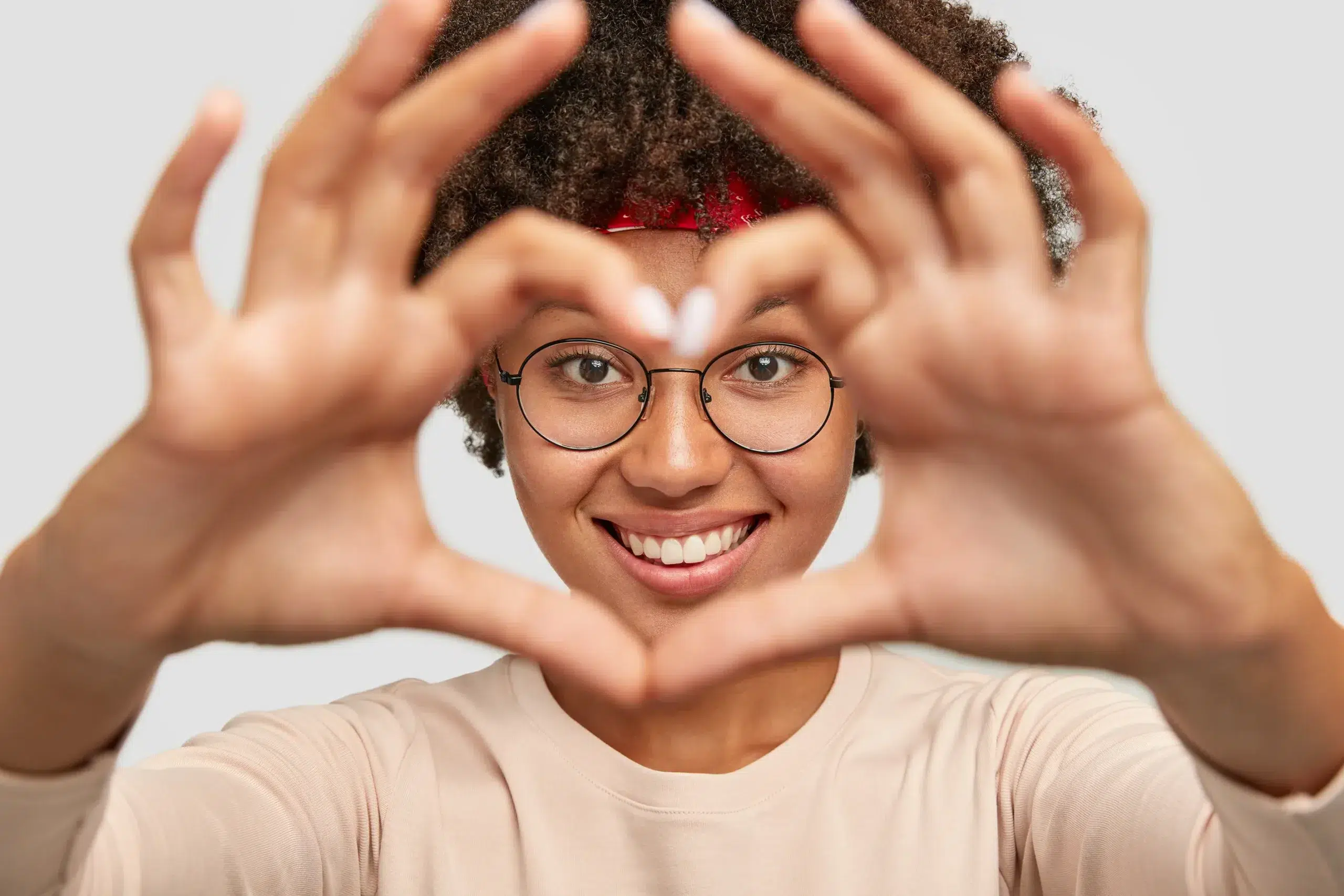 Close Up Shot Cheerful Carefree Charming Girl Makes Heart Shape Hand Sign