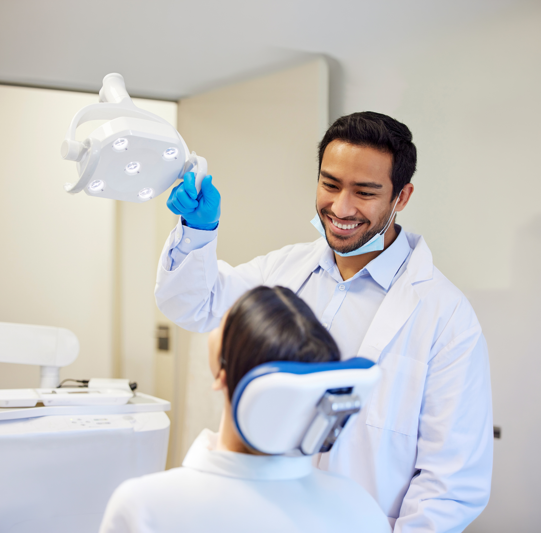 Shot Of A Young Dentist Getting Ready To Conduct A Procedure On His Patient